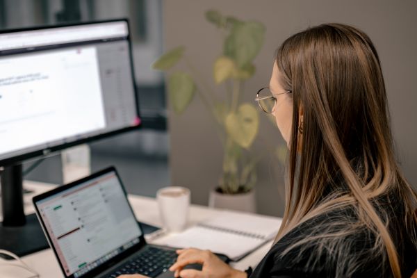 IT professional examining key vulnerability management trends of 2024 on a screen