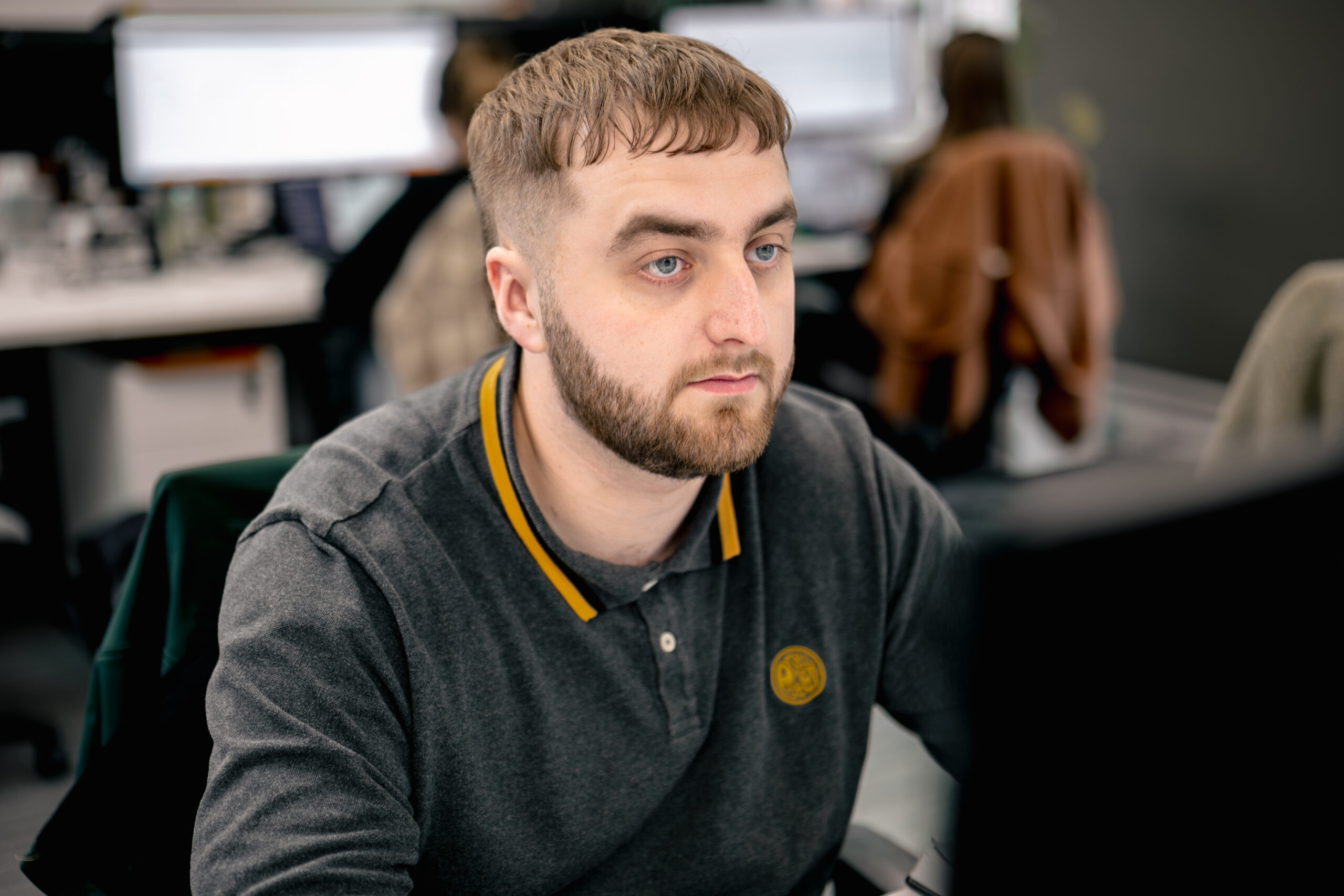 Cybersecurity professional working on cloud security assessment tasks at desk