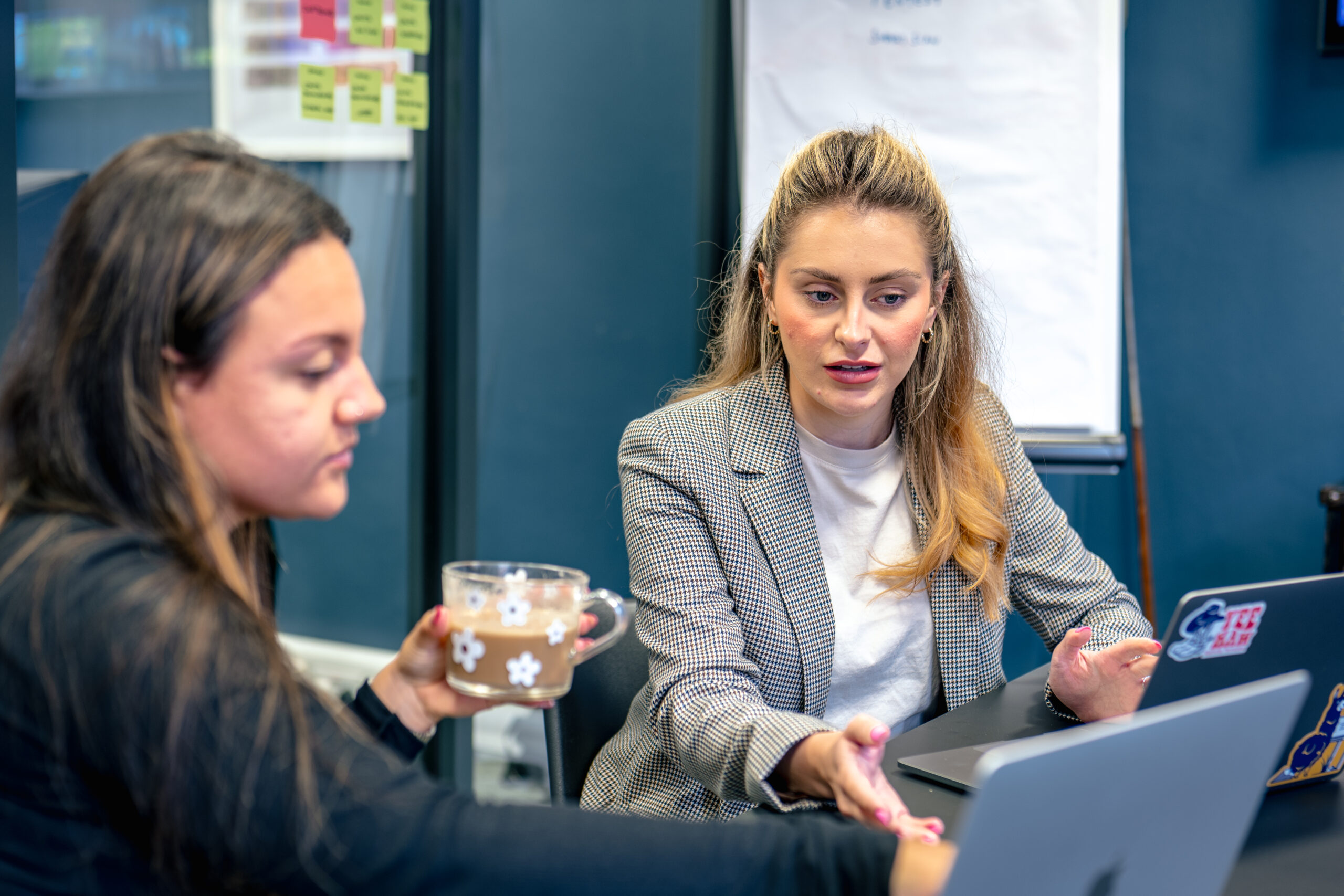 Consultants collaborating on red team exercise plans and tactics in a meeting