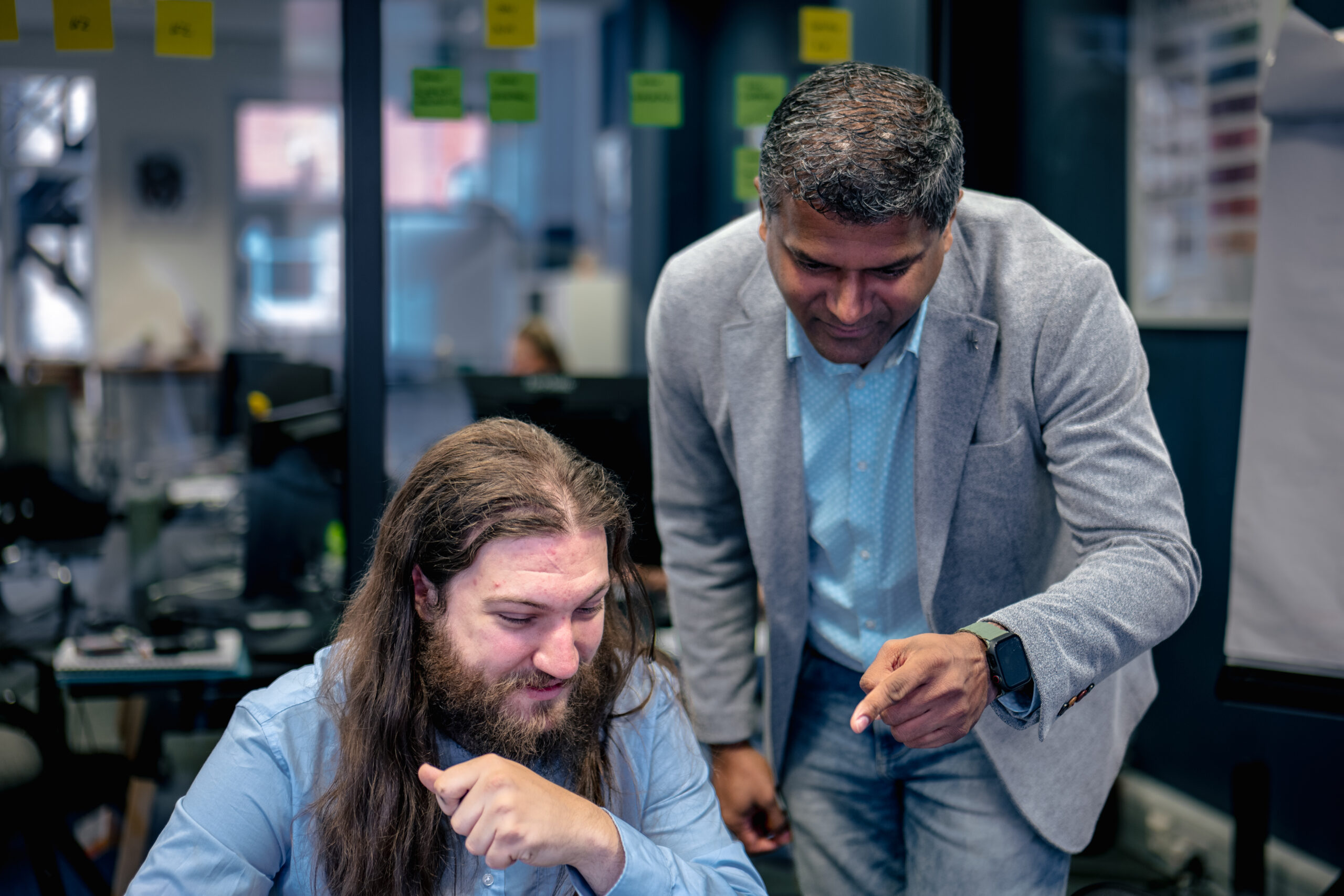 Technical Director and Cyber Analyst reviewing file upload vulnerability information on a laptop