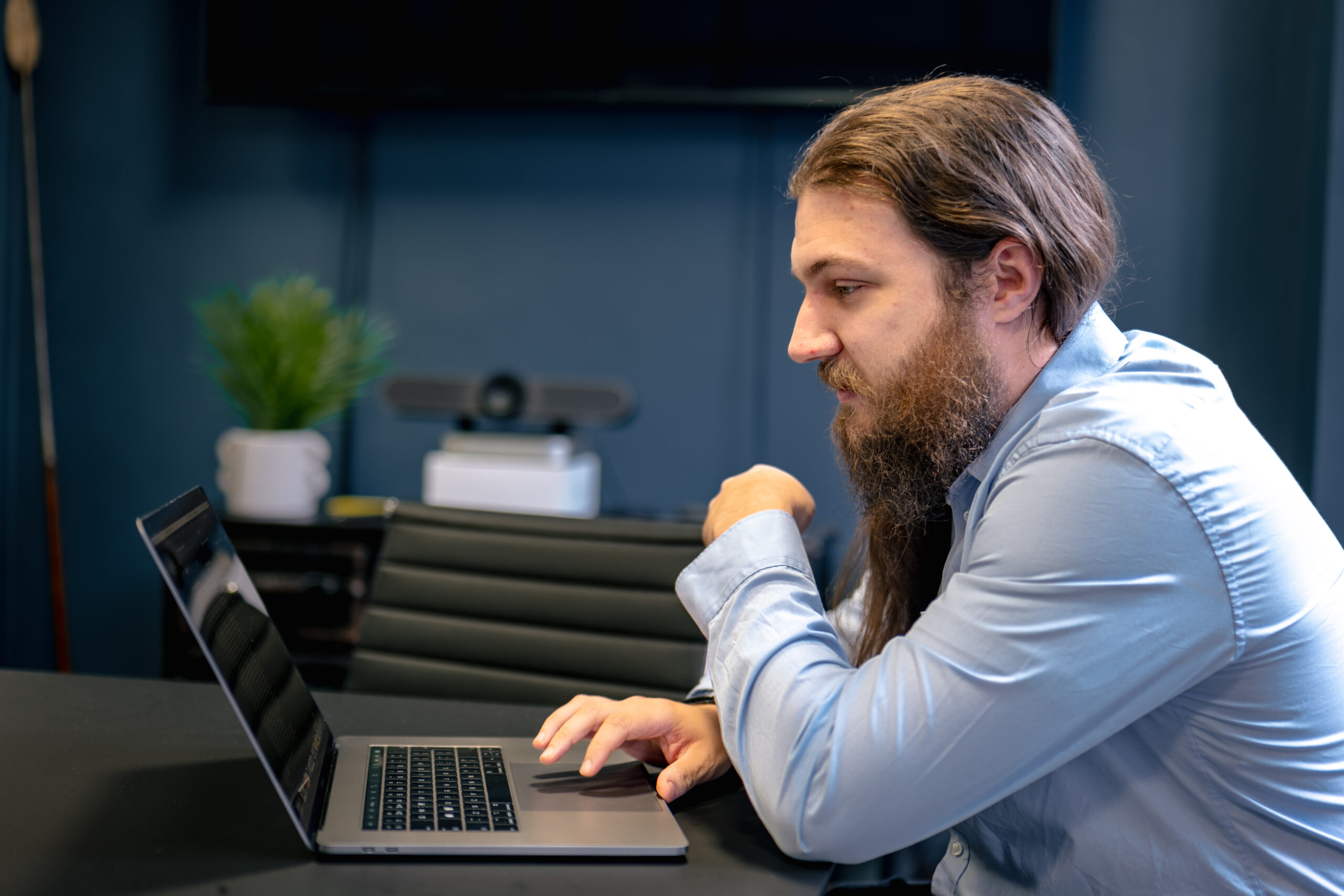 Junior Security Analyst reviewing Microsoft 365 tenant details on laptop